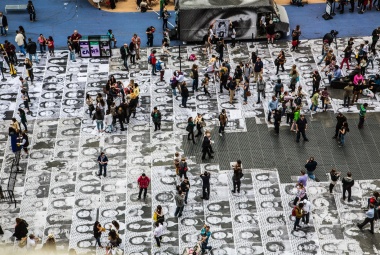 JR (French, born 1983). Inside Out, Times Square, New York City, 2013. Installation image. Wheat-pasted posters on buildings. © JR-ART.NET