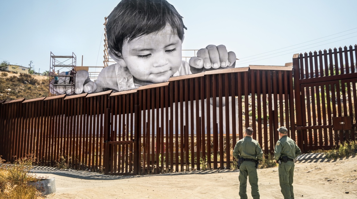 JR (French, born 1983). GIANTS, Kikito and the Boarder Patrol, Tecate, Mexico—U.S.A., 2017.