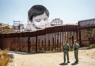 JR (French, born 1983). GIANTS, Kikito and the Boarder Patrol, Tecate, Mexico—U.S.A., 2017.